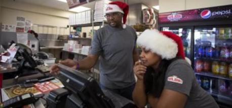 Jarvis and Josslyn Young working in their Papa Johns restaurant